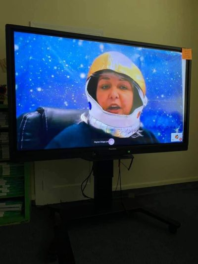 Principal in a space helmet